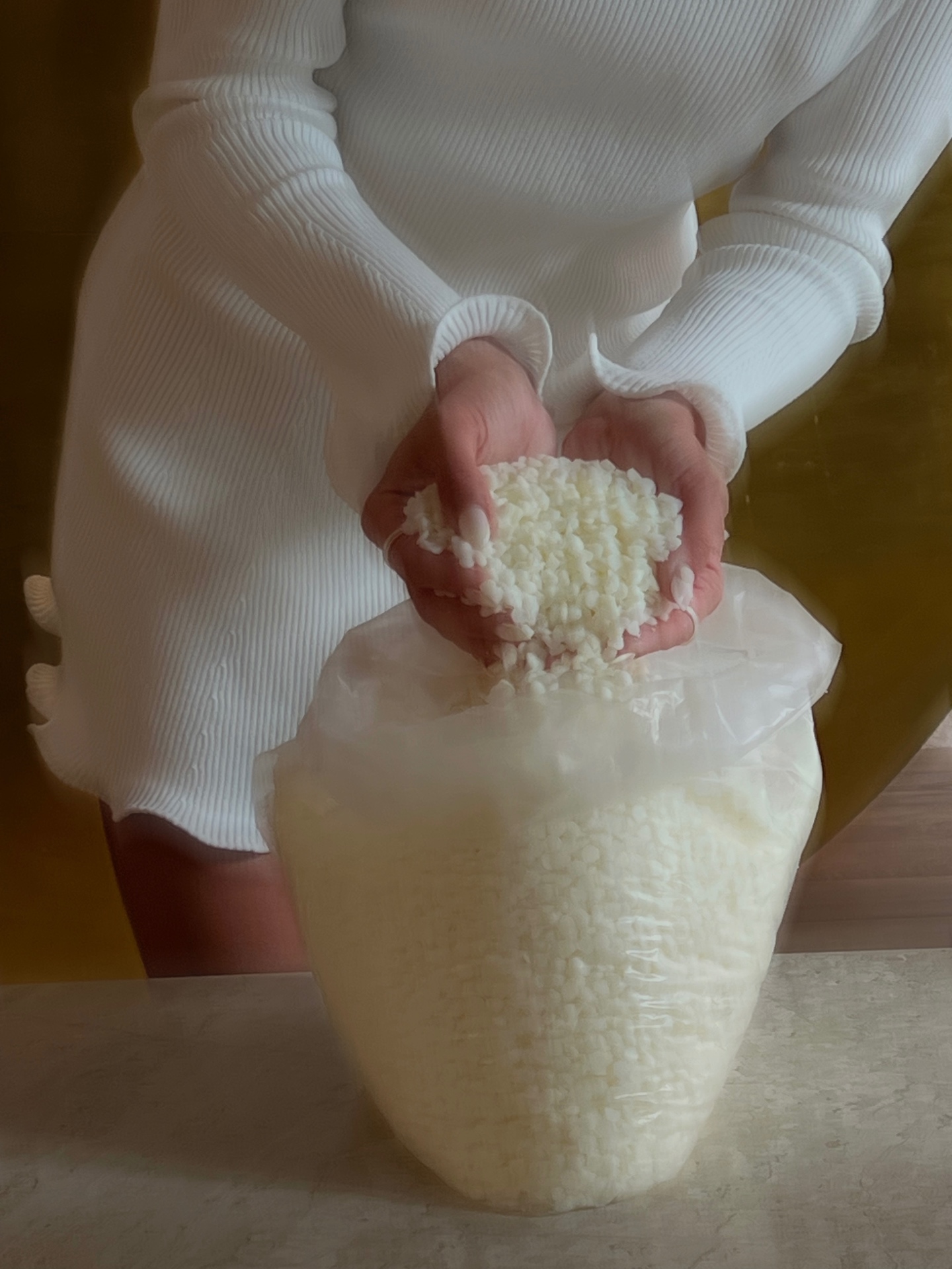 Hand-pouring candles in small batches