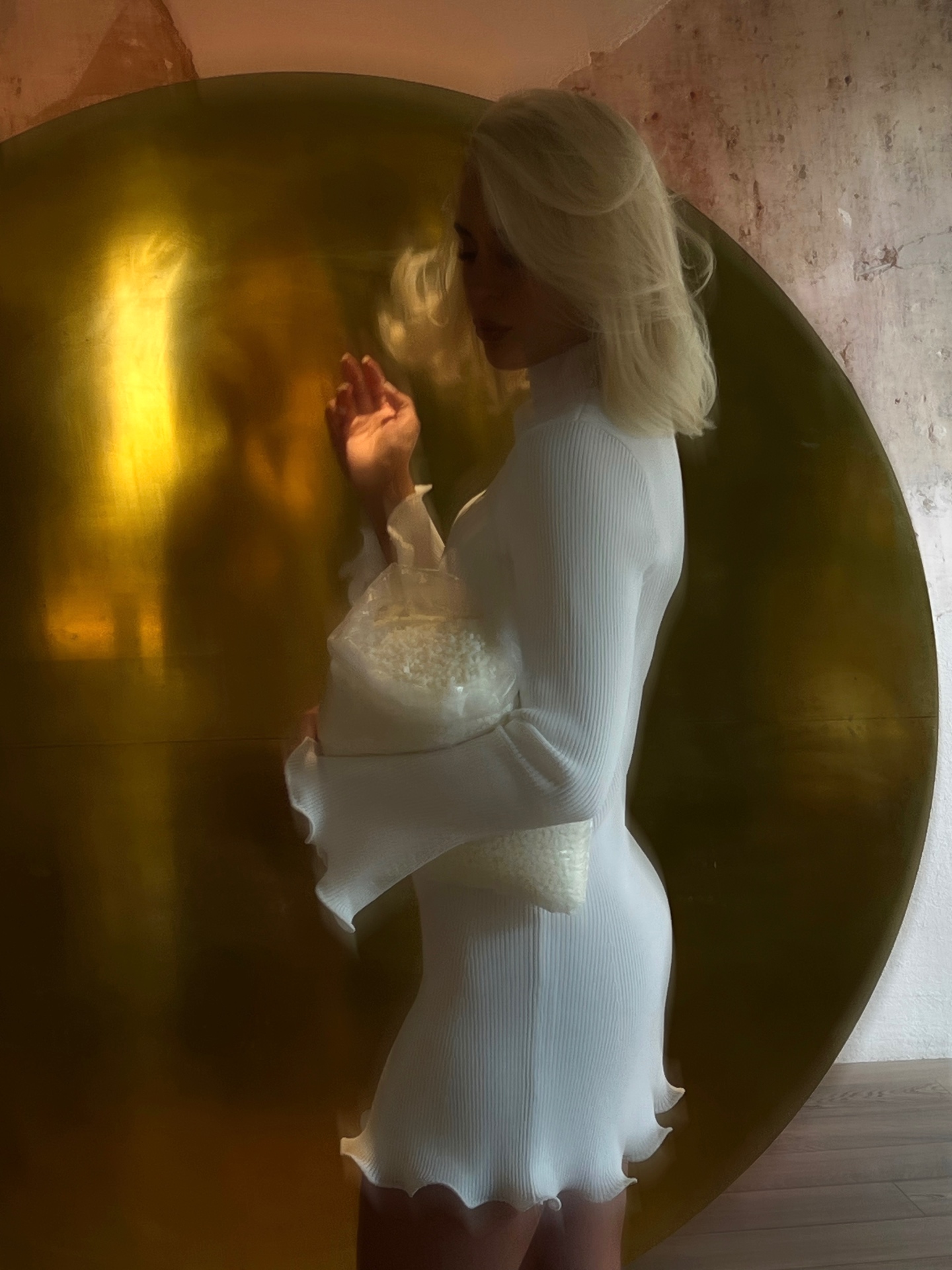 A NIDA JOURNEY candle carried in warm afternoon light